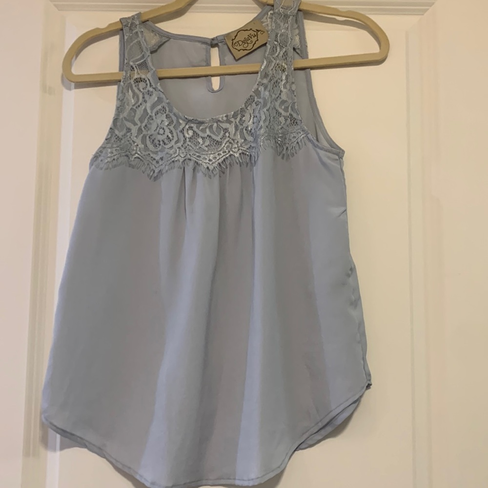 Blue sleeveless blouse with lace detail